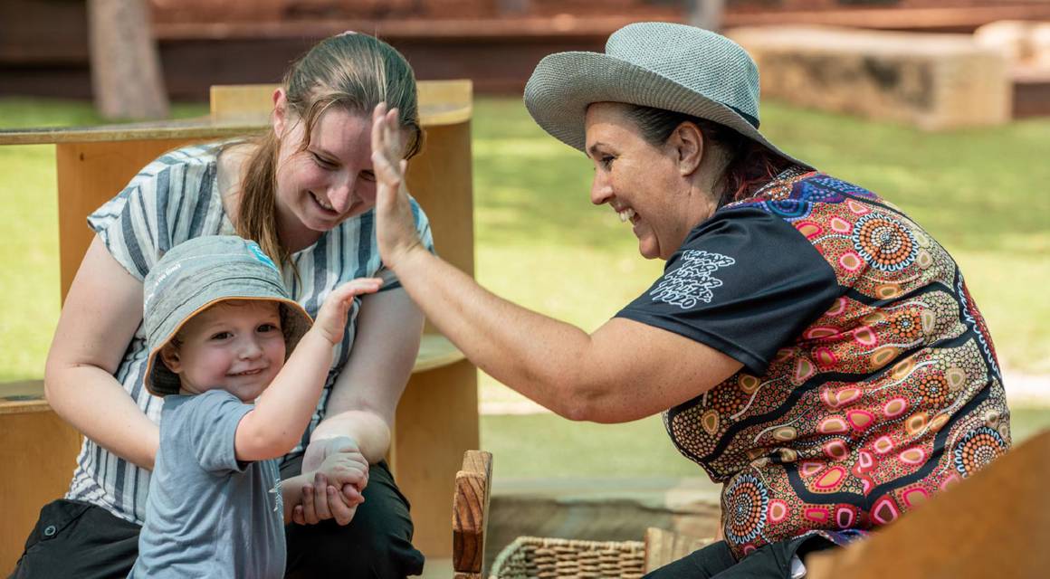 Goodstart Early Learning Centre educators with child