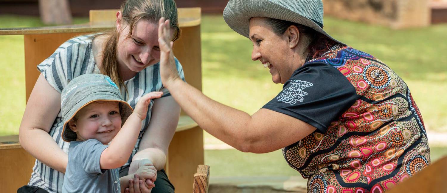 Goodstart Early Learning Centre educators with child