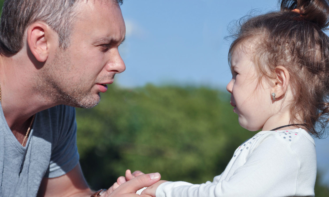 Father listening to distressed daughter