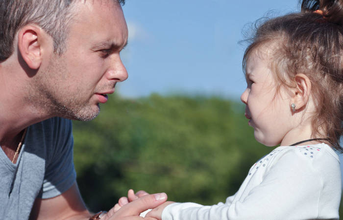 Father listening to distressed daughter