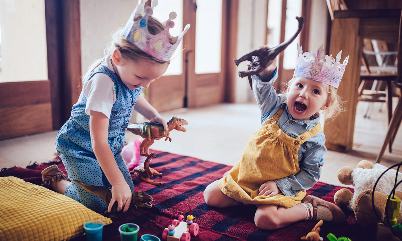 Two children playing on the floor