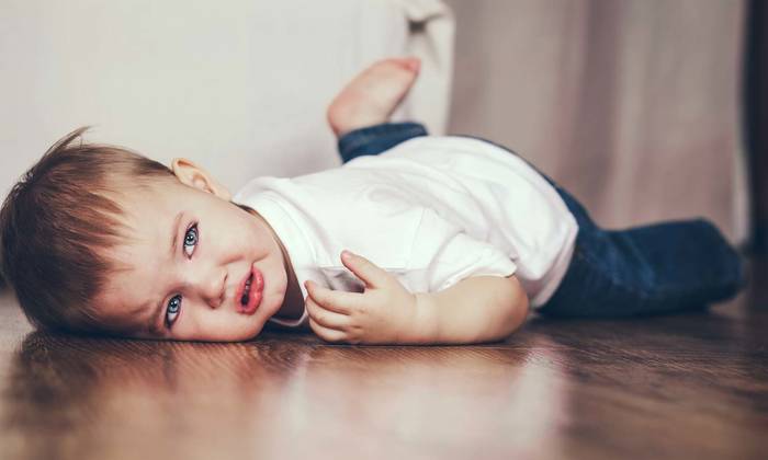 Toddler lying on the floor