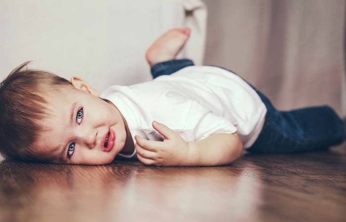 Toddler lying on the floor