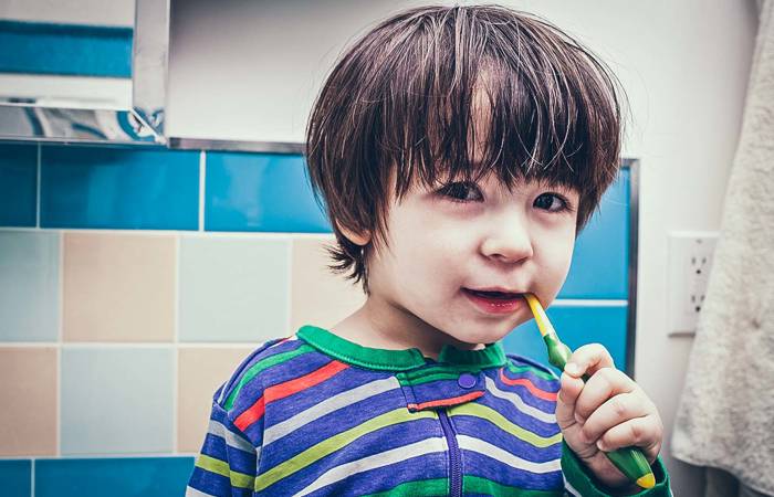Small boy brushing his teeth
