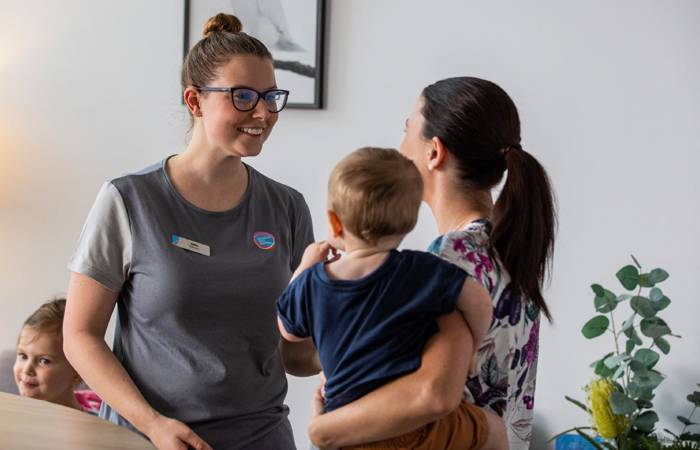 Early learning educator with family