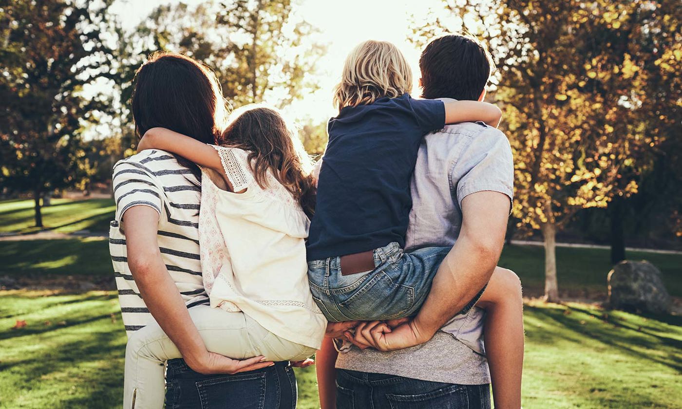 Parents piggy-backing children