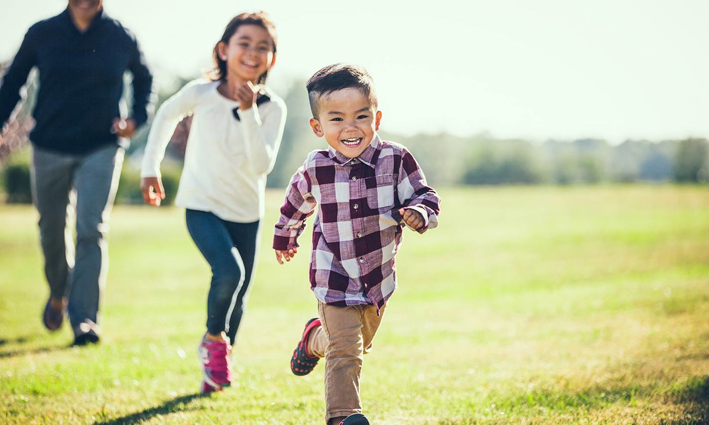 Child playing outside with Dad