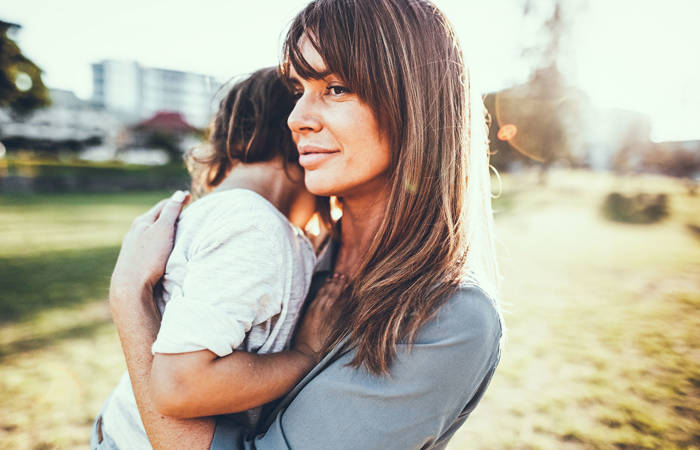 Mother comforting small child