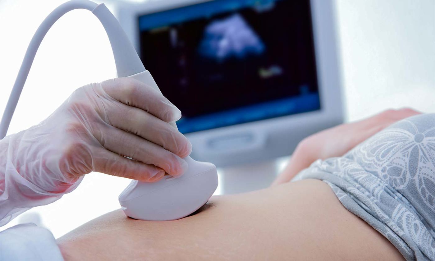 ultrasounds on woman's stomach
