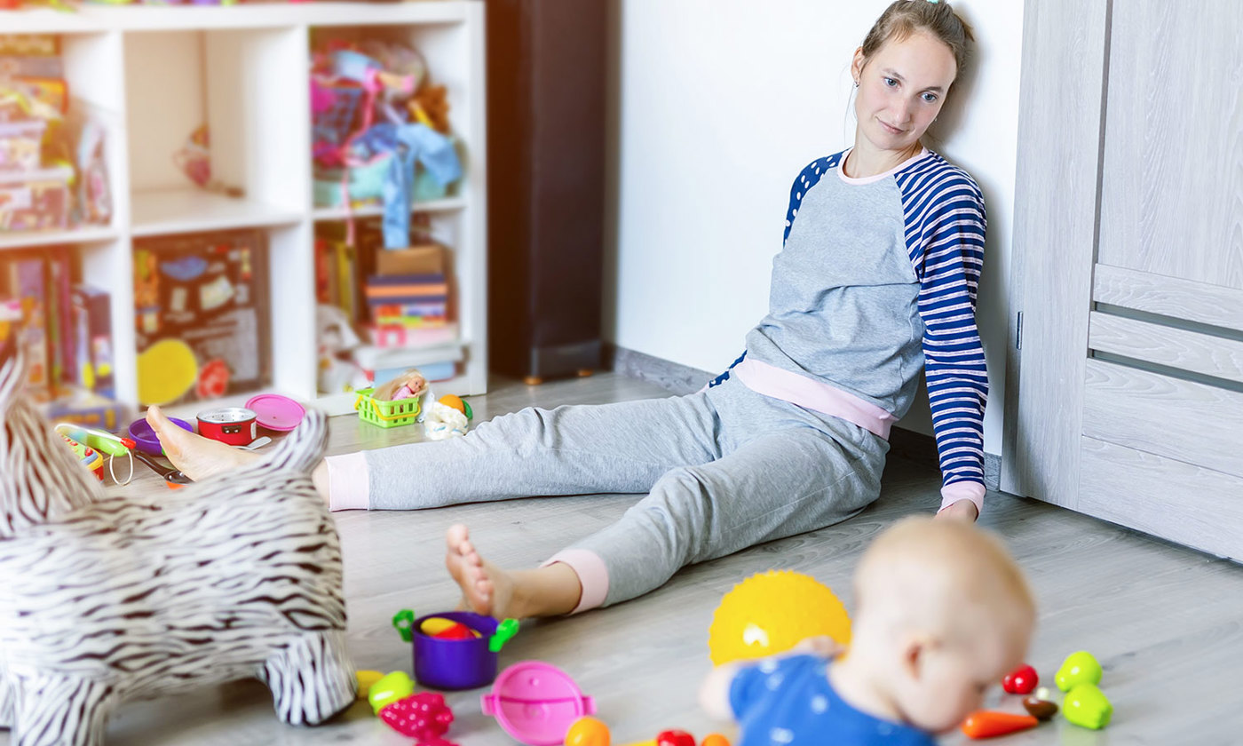 Mother on the floor looking at baby