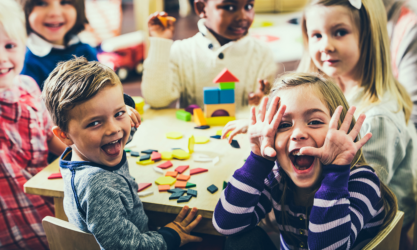 Playful preschoolers having fun making faces