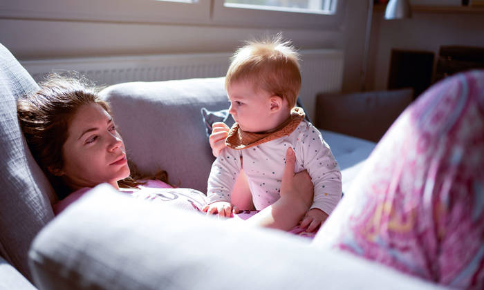 Tired mother with baby