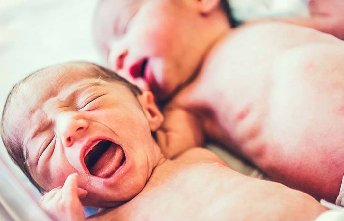 twin newborns crying