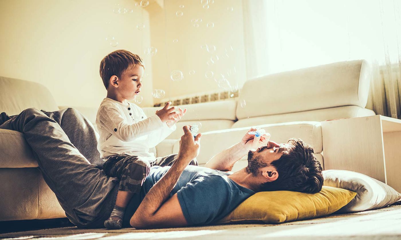 Son playing with dad