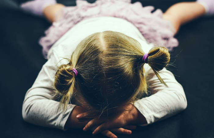 Child lying on the floor