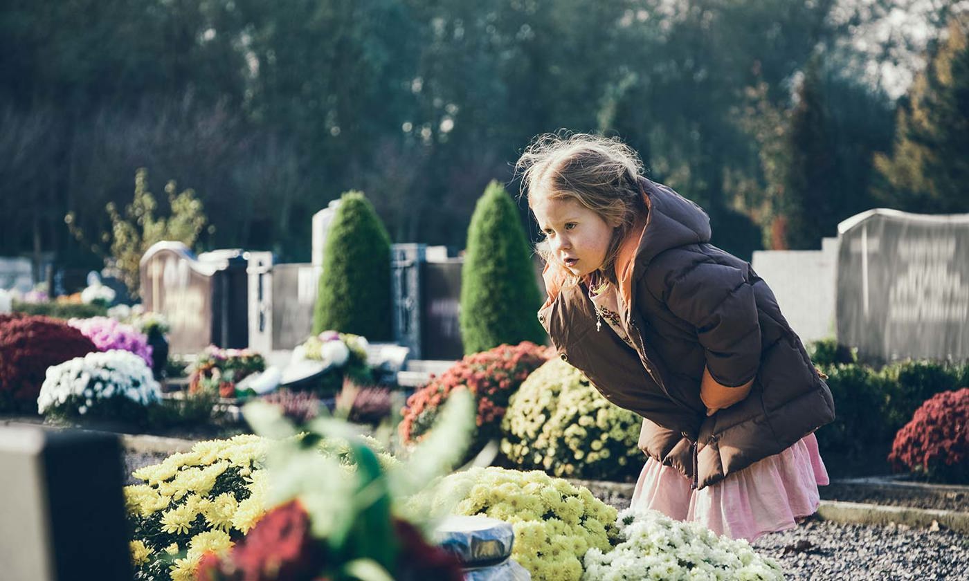 Child at a cemetery