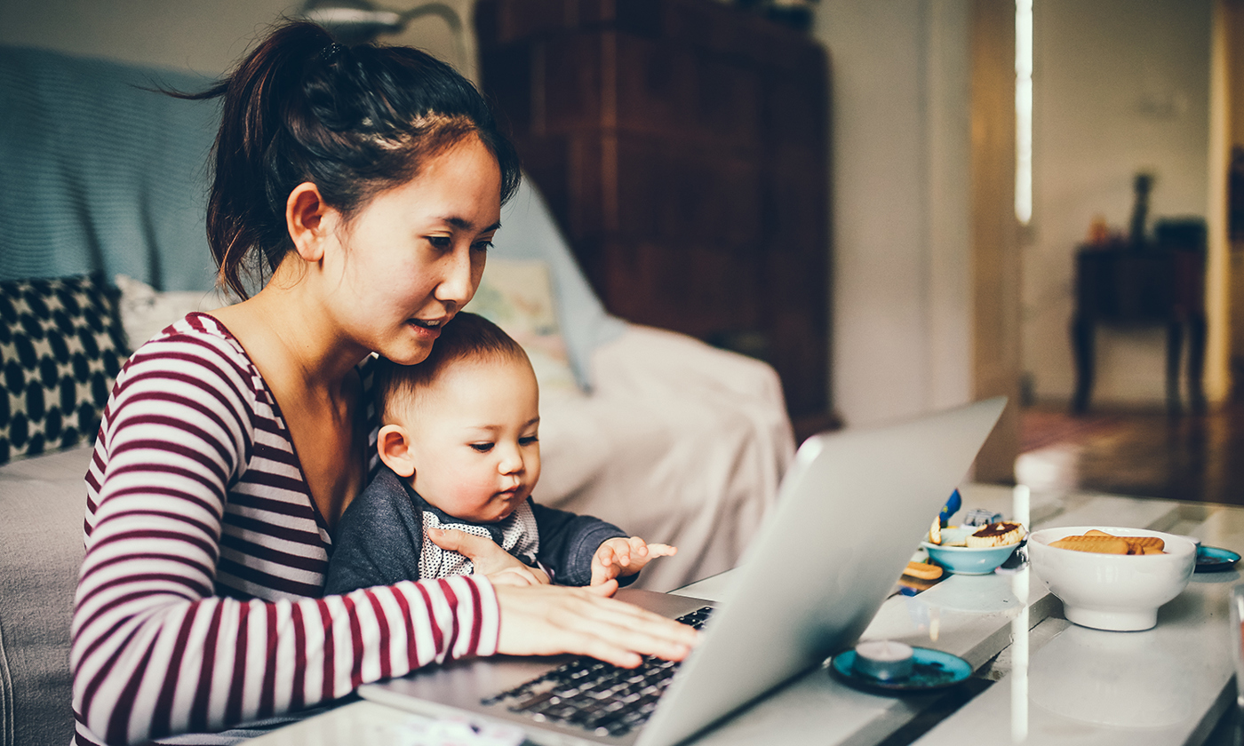 Mum trying to work with her baby boy