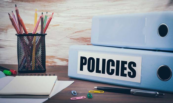 Policies folder on a desk